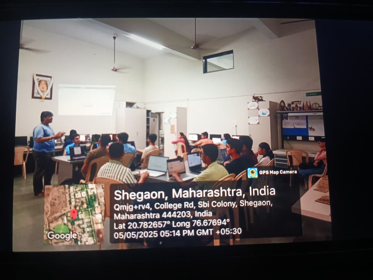 Students operating a 3D printer